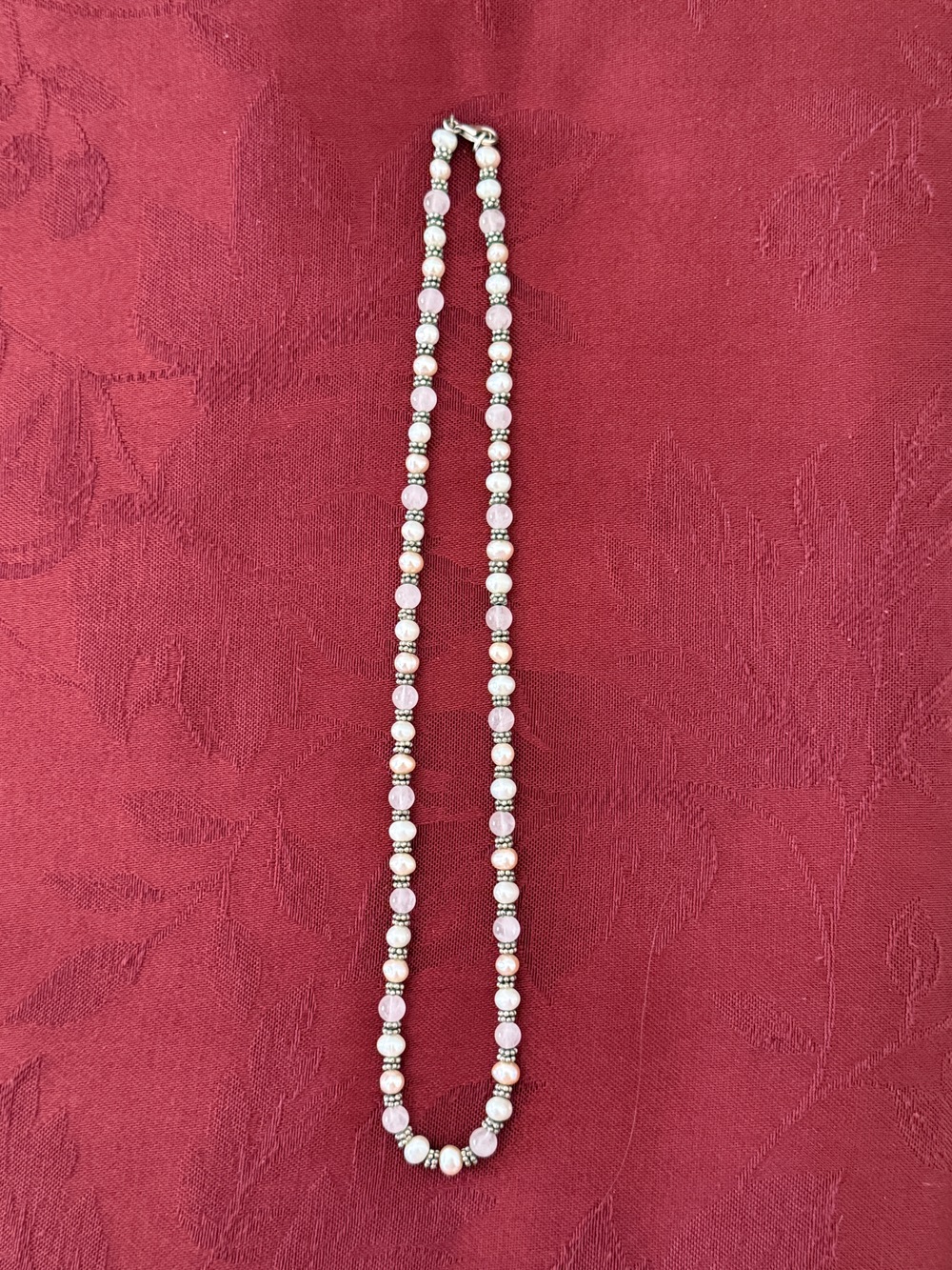 Delicate beaded necklace features pink, white  and silver
